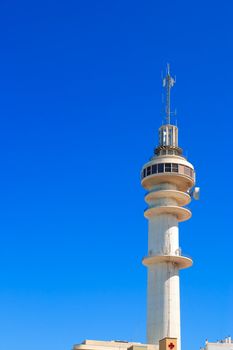 Communications tower with a beautiful blue sky