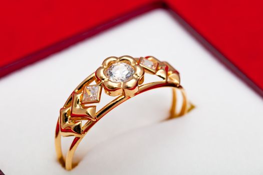 Fantastic gold ring adorned with several white zirconia