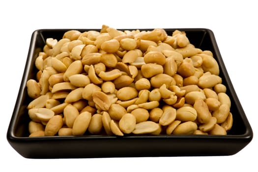 Picture of a bunch of peanuts on a black plate