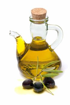 bottle of olive oil and fresh olives on white background
