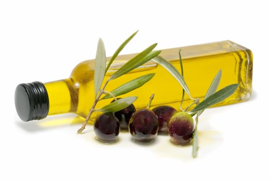 bottle of olive oil and fresh olives on white background