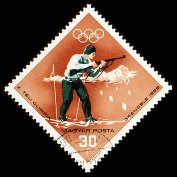 HUNGARY - CIRCA 1968: A post stamp printed in Hungary shows biathlete with rifle, dedicated to the Olympic Winter Games in Grenoble, series, circa 1968