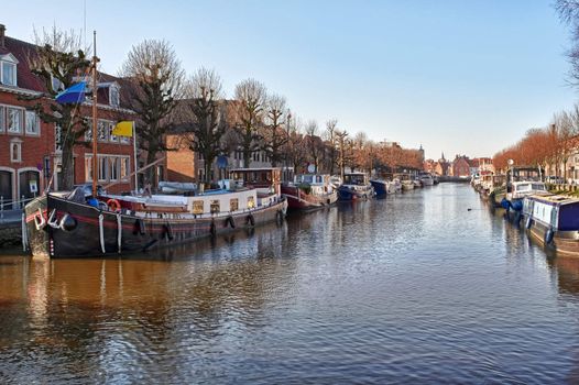 cping barge canal view in bruges, belgium