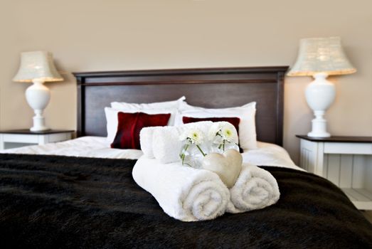 Bedroom ready for guests in soft warm lighting