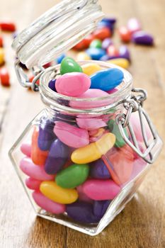 Colorful jelly beans in a bottle - very shallow depth of field