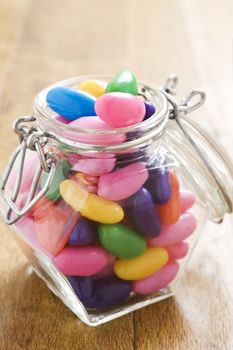 Colorful jelly beans in a bottle - very shallow depth of field