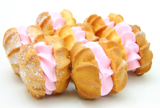 Yellow cookies with a stuffing on a white background