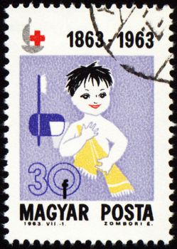 HUNGARY - CIRCA 1963: A stamp printed in Hungary, shows baby wash, circa 1963