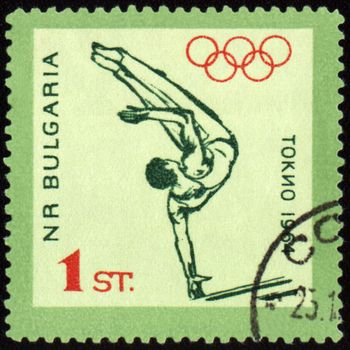 BULGARIA - CIRCA 1964: A post stamp printed in Bulgaria shows gymnastics, devoted to Olympic games in Tokio, series, circa 1964