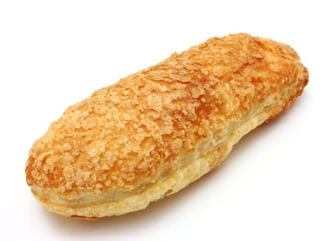 White roll strewed by sugar with a ruddy crust on a white background