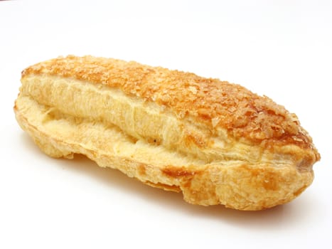 White roll strewed by sugar with a ruddy crust on a white background