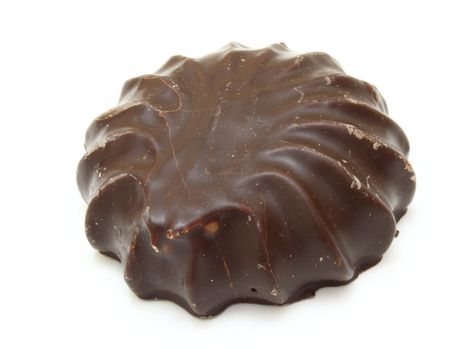 Marshmallow of black color lies on a white background