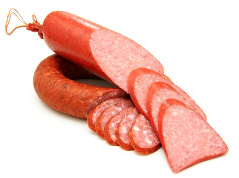 Tasty sausage is curtailed by a ring lies on a white background