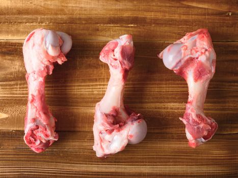 close up of pork bones on wooden table