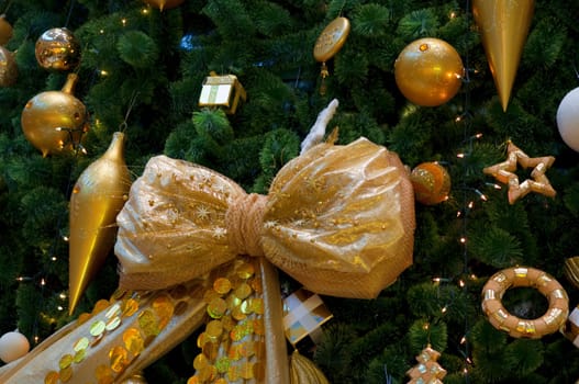 Christmas tree branch with Christmas ball. Decorated Christmas tree with a ball.