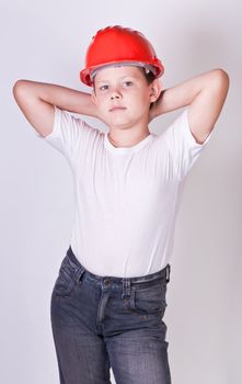 Portrait of a boy in a red protective helmet