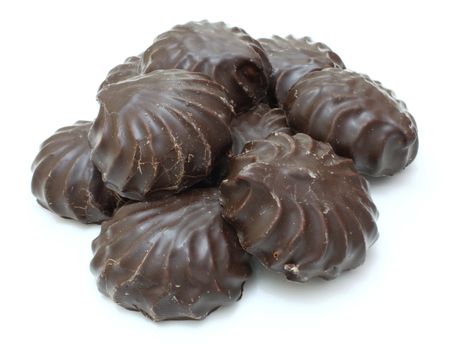 Marshmallow of black color lies on a white background