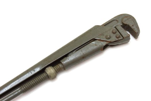 The big metal wrench for untwisting of pipes on a white background