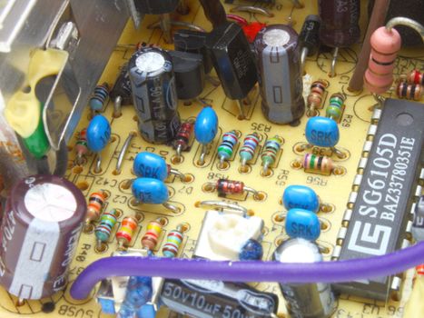 The computer power unit in an open kind with details and electric wires