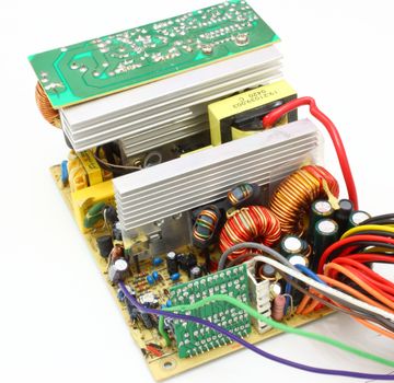 The computer power unit in an open kind with details and electric wires