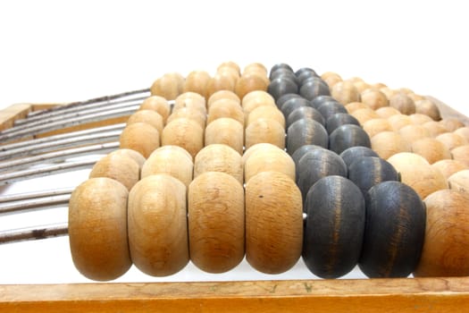 Accounting abacus for financial calculations lies on a white background