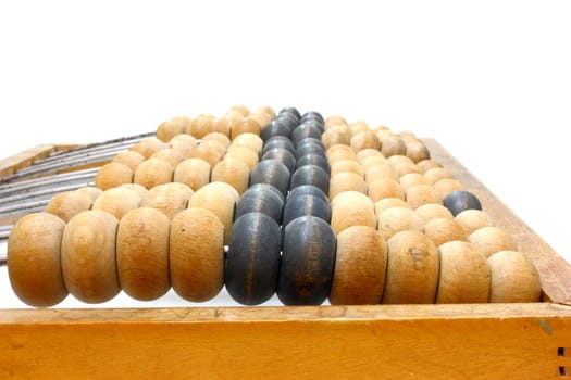 Accounting abacus for financial calculations lies on a white background