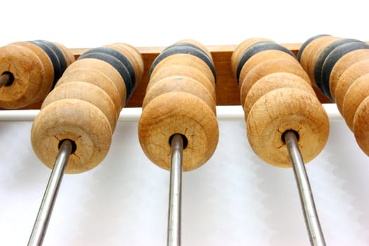 Accounting abacus for financial calculations lies on a white background