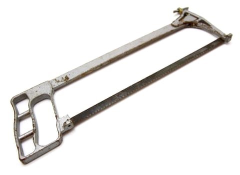 The old hacksaw on metal lies on a white background