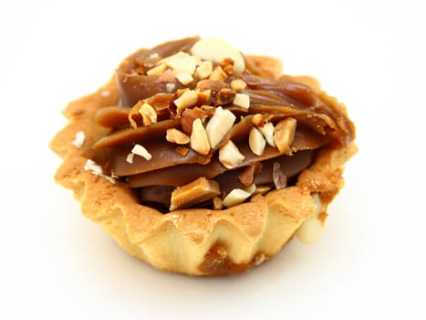 Pie a basket with chocolate condensed milk and nuts on a white background