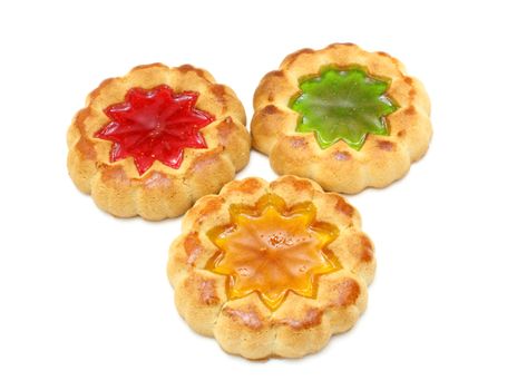 Cookies of yellow color with a stuffing from multi-colored jelly in the middle on a white background