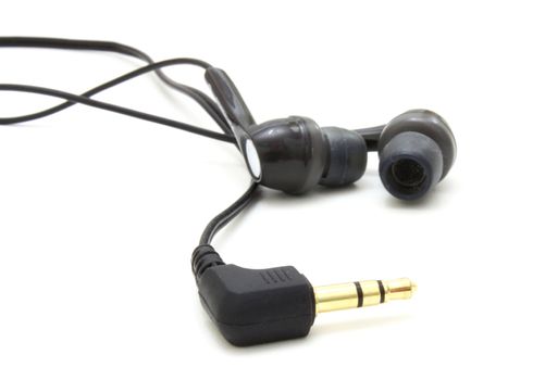 Small ear-phones and the tip for connection on a white background