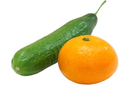 The fresh green cucumber with a tangerine lies on a white background