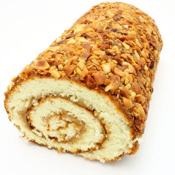Fresh roll with jam and nuts on a white background