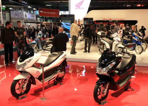 People visit Honda motorcycles area at EICMA, International Motorcycle Exhibition in Milan, Italy.