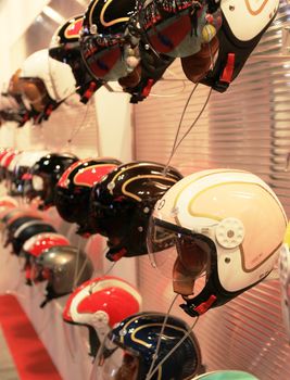 Helmets in exhibition at EICMA, International Motorcycle Exhibition in Milan, Italy.