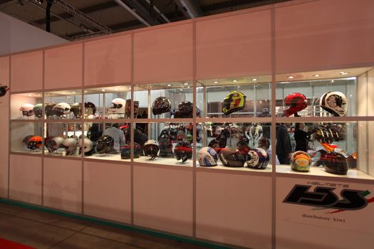 Looking at products and brand new motorcycles during EICMA, International Motorcycle Exhibition in Milan, Italy.