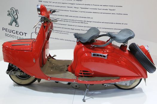 Special vintage Peugeot motorcycle in exhibition at EICMA, International Motorcycle Exhibition in Milan, Italy.