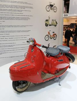 Special vintage Peugeot motorcycle in exhibition at EICMA, International Motorcycle Exhibition in Milan, Italy.