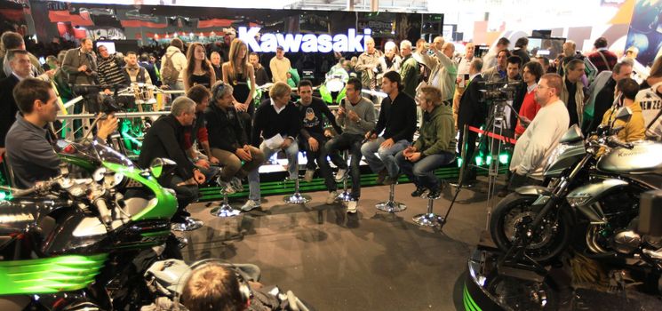 Kawasaki brand new products  area visited by people crowd at EICMA, International Motorcycle Exhibition in Milan, Italy.