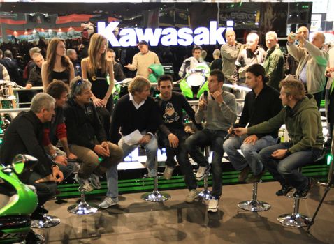 Kawasaki brand new products  area visited by people crowd at EICMA, International Motorcycle Exhibition in Milan, Italy.