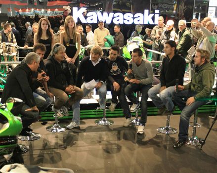 Kawasaki brand new products  area visited by people crowd at EICMA, International Motorcycle Exhibition in Milan, Italy.