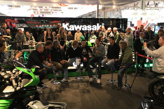 Kawasaki brand new products  area visited by people crowd at EICMA, International Motorcycle Exhibition in Milan, Italy.