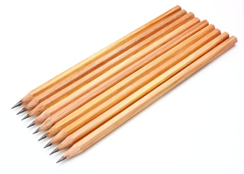 The yellow ground pencil lies is isolated on a snow-white background