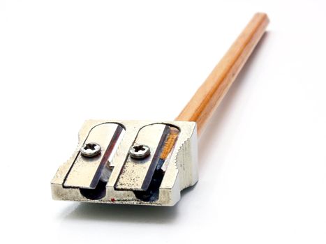 shot of eraser, pencil and pencil metal double sharpener on a white background