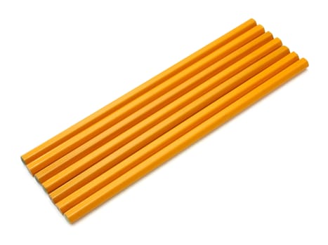 The yellow ground pencil lies is isolated on a snow-white background