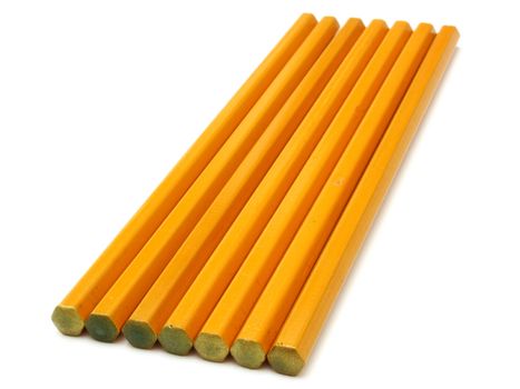 The yellow ground pencil lies is isolated on a snow-white background