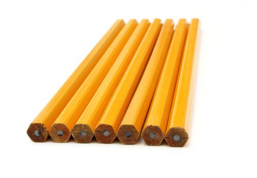 The yellow ground pencil lies is isolated on a snow-white background