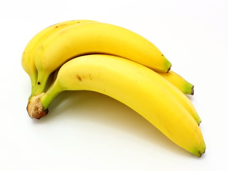 Yellow bananas apples and pears a still-life on a white background