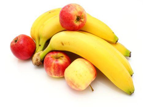 Yellow bananas apples and pears a still-life on a white background