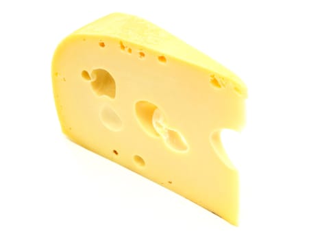 A piece of Swiss cheese isolated on white yellow delicatessen;